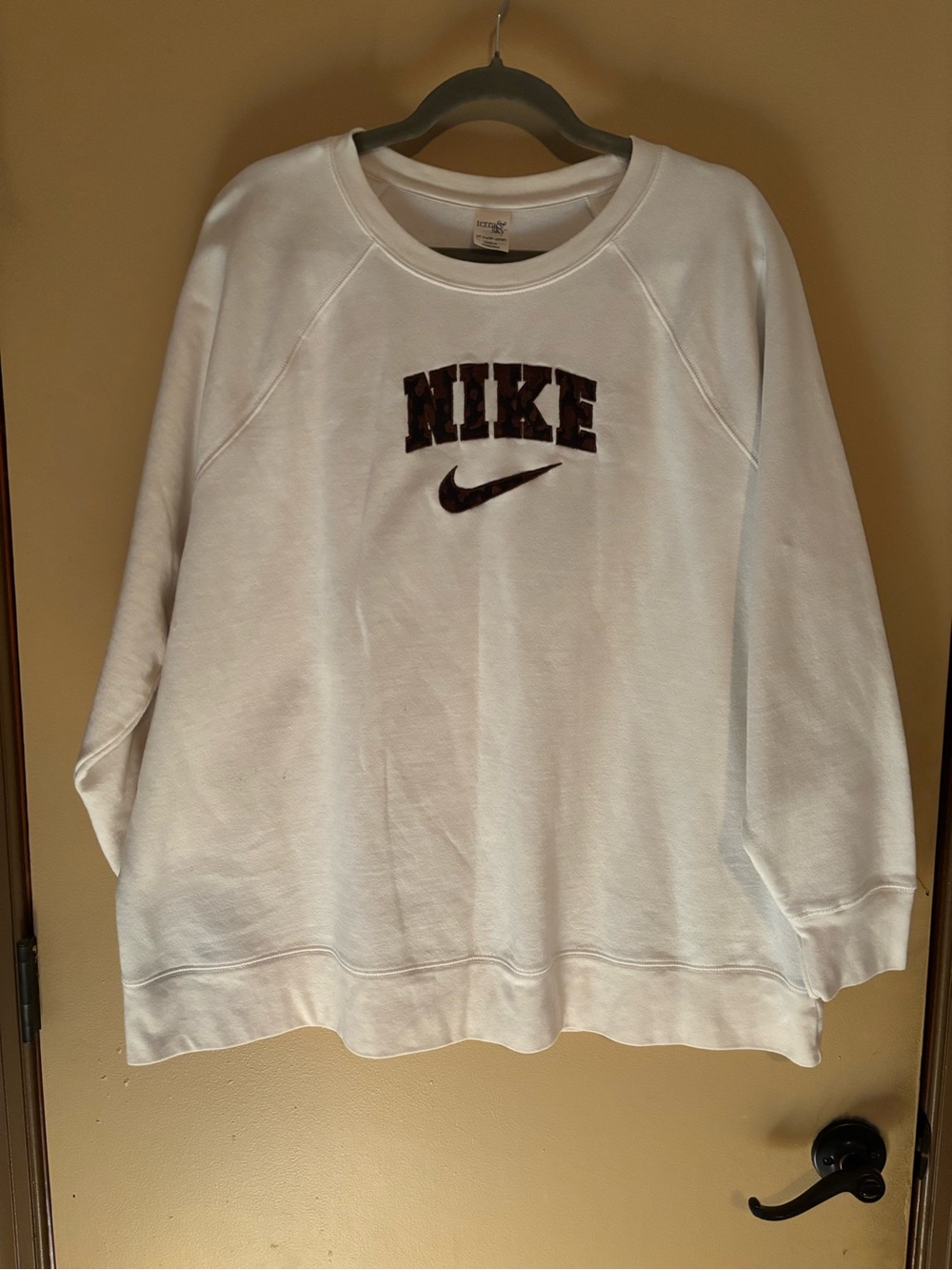Women's White Crewneck Sweatshirt with Embroidered Brown Cow Print Nike Logo